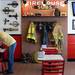 Firefighter memorabilia hangs on the wall as a customer rummages through his bad while in the dinning room at Firehouse Subs.  Melanie Maxwell I AnnArbor.com